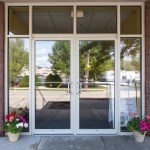 Outside office building - door swinging glass