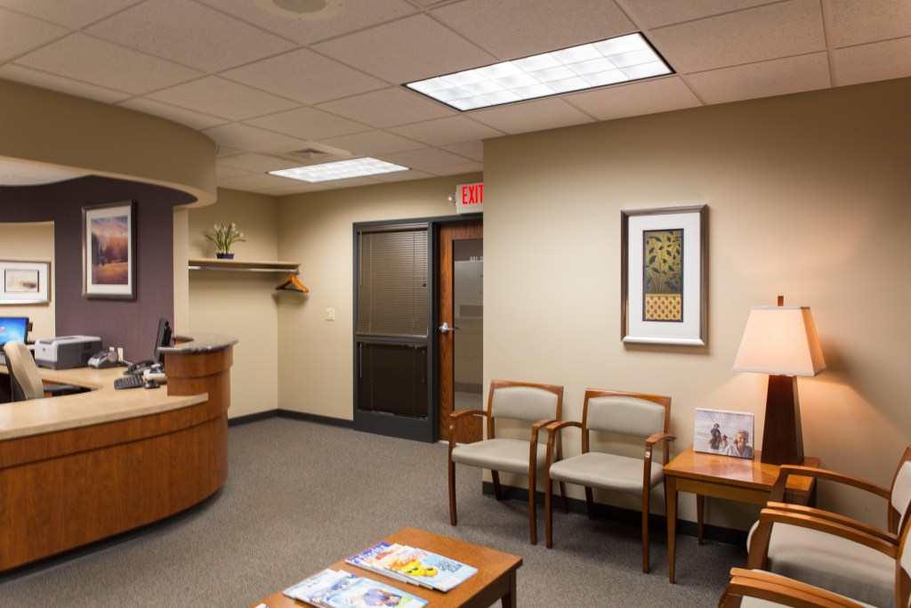 Patient area with reception desk and two chairs