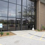 Outside of office building, with large glass doors
